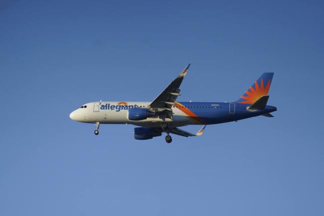 FILE - An Allegiant Airbus A320 prepares to land in South Bend, Ind., Nov. 6, 2021. (AP Photo/Paul Sancya, File)