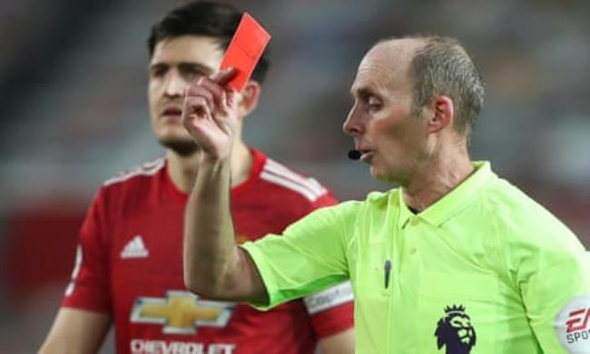 Mike Dean shows Jan Bednarek of Southampton a red card
