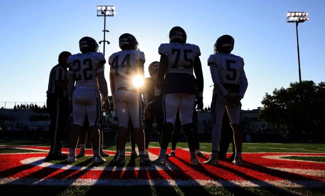 The Petaluma Trojans and the Rancho Cotate Cougars gather for the coin toss, Friday, Aug. 25, 2023 at Santa Rosa Junior College. (Kent Porter / The Press Democrat)