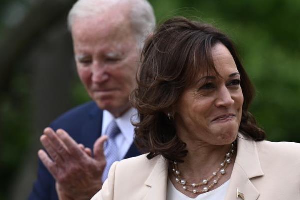 President Joe Biden looks on as Vice President Kamala Harris delivers remarks from the White House Rose Garden on May 1.