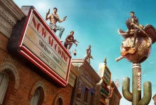 Several characters sit or stand around a couch in Saints Row.