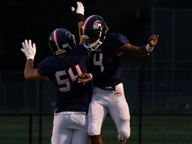 Rancho Cotate quarterback Jacob Pruitt, right, celebrates after running down the field off of a quarterback sneak for a touchdown against Freedom High on Friday, Sept. 15, 2023 in Rohnert Park. (Nicholas Vides / For The Press Democrat)