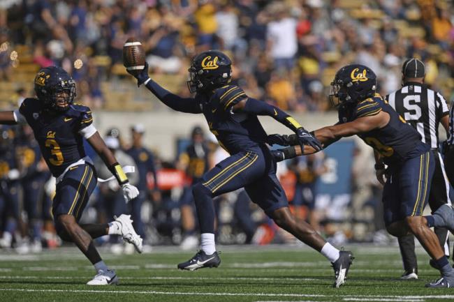 Cal’s Raymond Woodie III celebrates after recovering a fumble by Idaho’s Terez Traynor during the fourth quarter Saturday in Berkeley. (Jose Fajardo / SAN JOSE MERCURY NEWS)