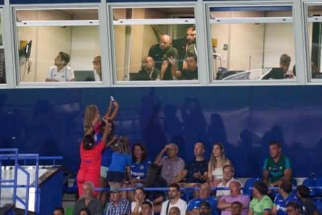 Fans attempt to get their shots of Xavi.