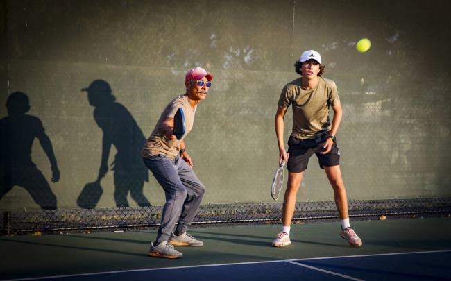 Chris Rosales, 61, and Cooper Harris, 16,  partner in a game of pickleball at Lucchesi Park on Thursday, August 24, 2023. (CRISSY PASCUAL/ARGUS-COURIER STAFF)