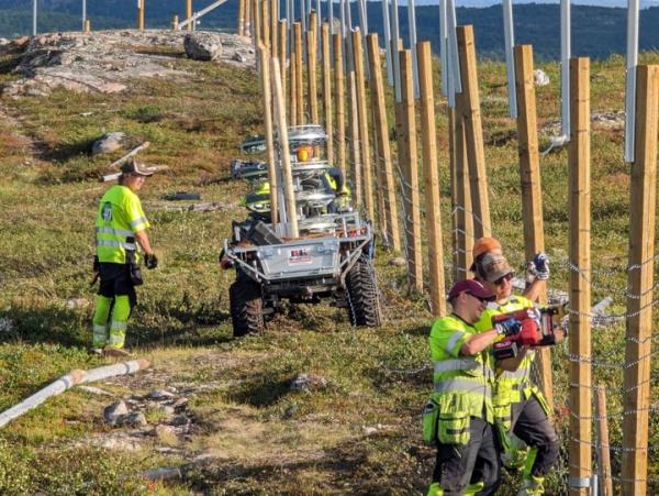 People work to build a new fence along the border with Russia next to Storskog, Norway on Wednesday.