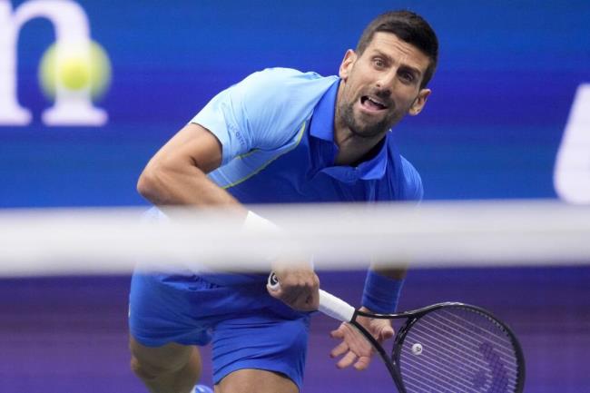 Novak Djokovic, of Serbia, returns a shot to Daniil Medvedev, of Russia, during the men's singles final of the U.S. Open tennis championships, Sunday, Sept. 10, 2023, in New York. (AP Photo/Charles Krupa)